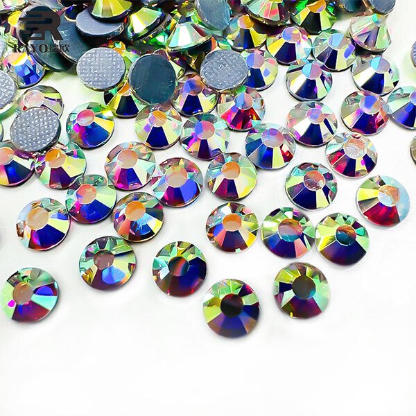 Closeup of scattered Crystal AB hotfix rhinestones showing brilliance